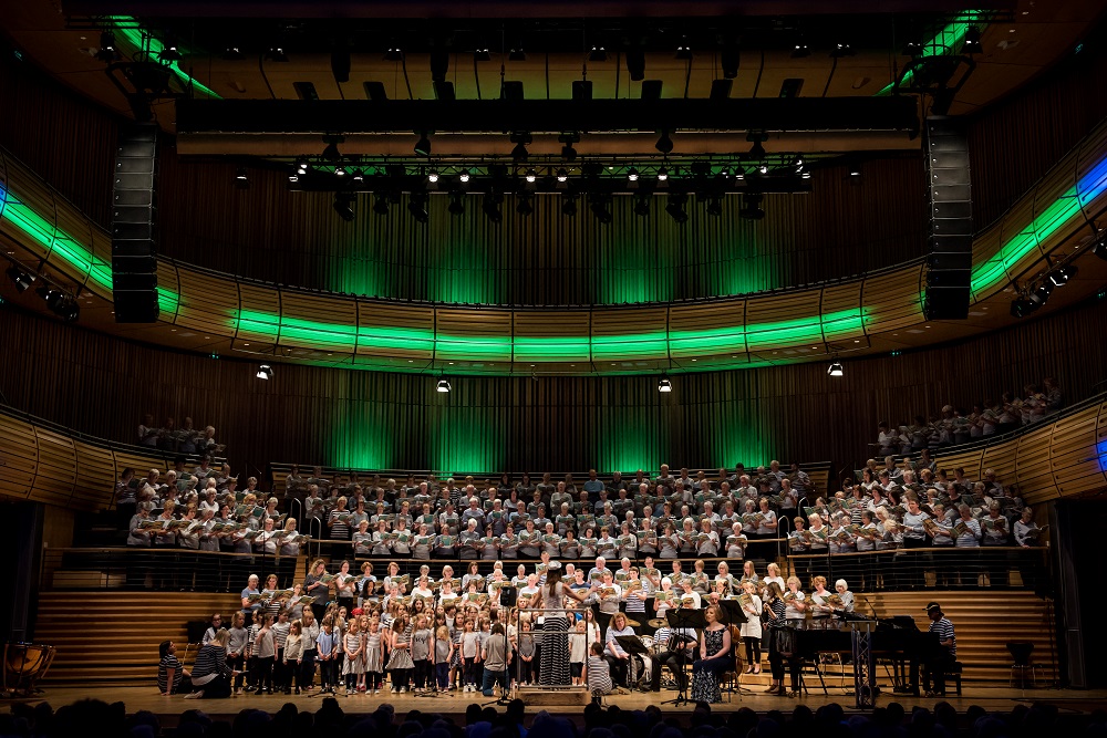 View of choir and instrumentalists, green lighting