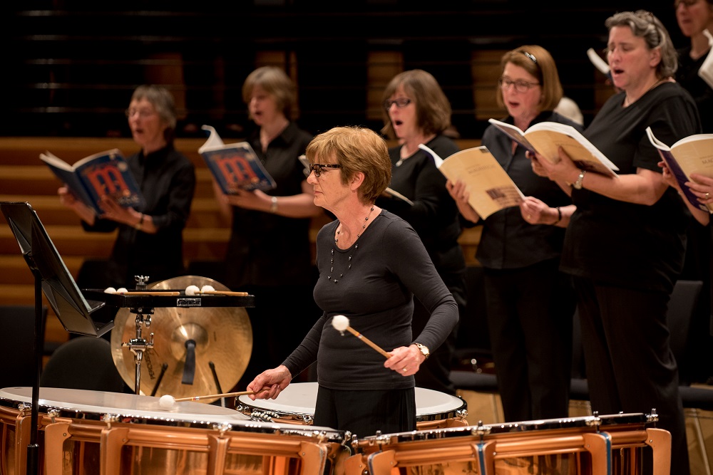 Solosit playing timpani and some choir members