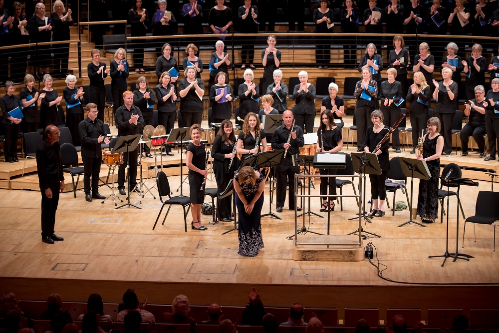 Soprano soloist Hanna-Liisa Kirchin taking a bow to applause.